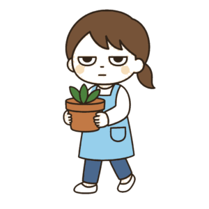 台風に備えて植木鉢を運ぶ保育士