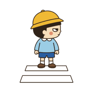 横断歩道の前で左右を確認する子ども