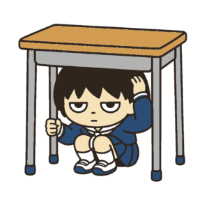 地震で机の下に隠れる子ども