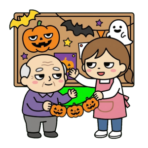 ハロウィンの飾りつけをするお年寄りと職員